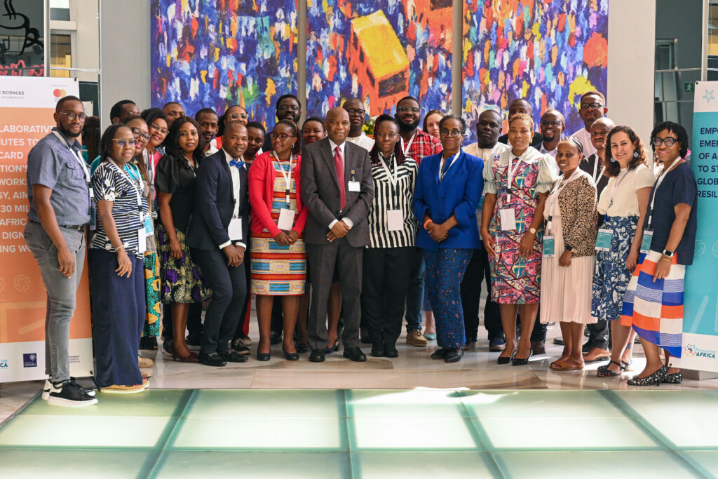 Participants from the MEAL onboarding workshop pose for a group photo with the Provost (College of Medicine, University of Ibadan) Prof T.O. Ogundiran and Carol Nuga, the Director of Impact, Mastercard Foundation
