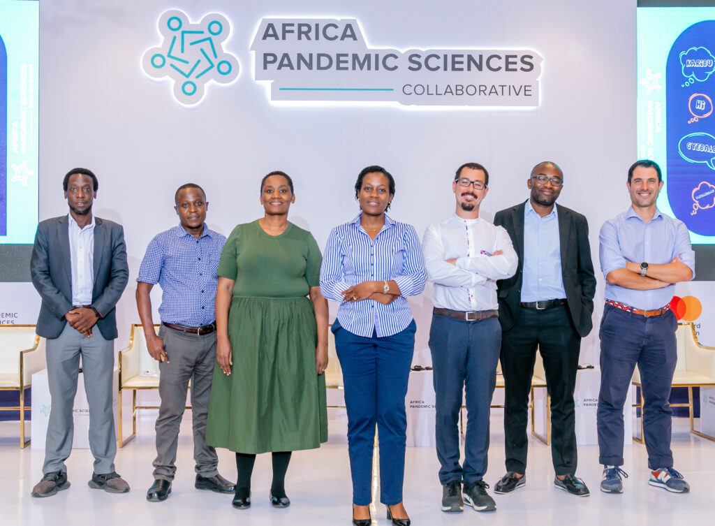 Dr Christine Sekaggya and posing for a photo with her consortium partners